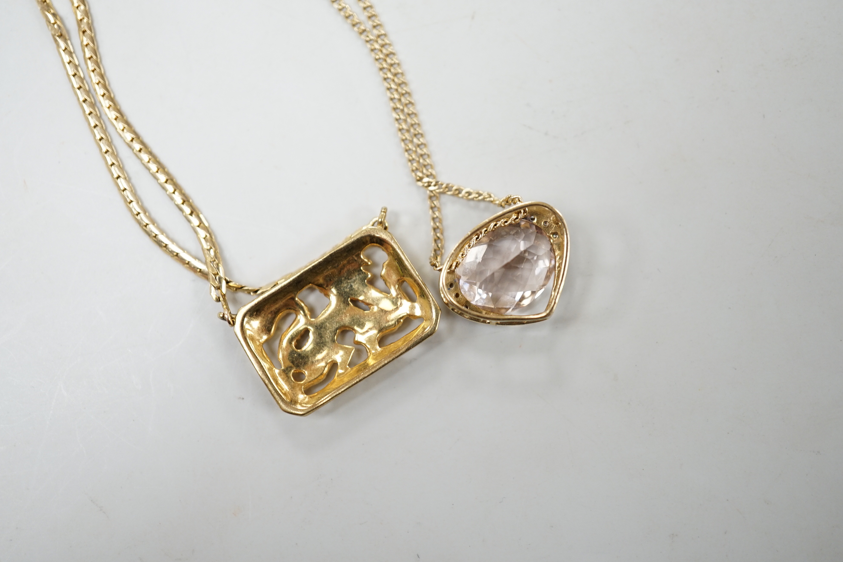 A modern 9ct gold and morganite? set heart shaped pendant necklace, 52cm and a 9ct gold Italian 'dragon' pendant necklace, gross weight 12.8 grams.